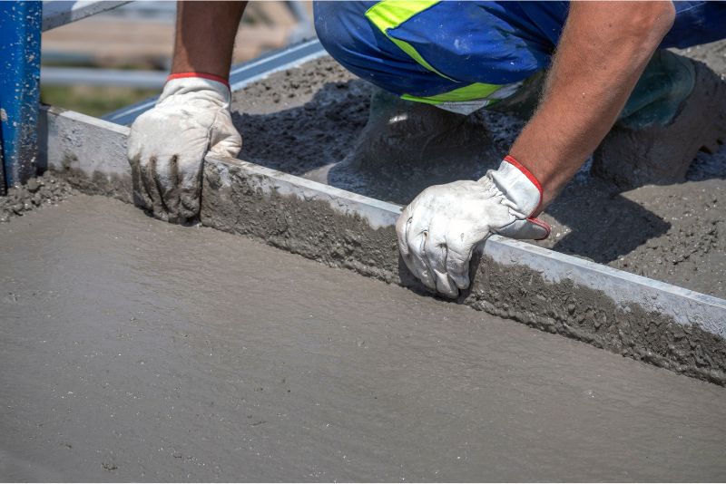 concrete being levelled by a contractor