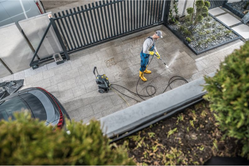 A concrete driveway being washed