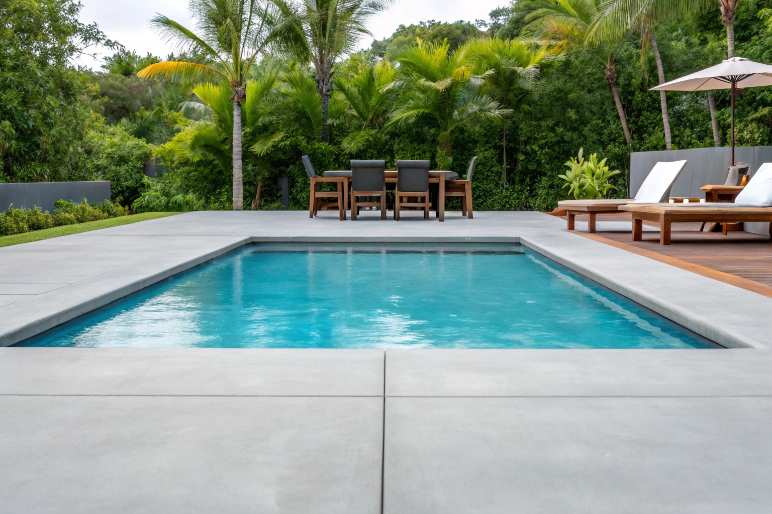 Concrete pool surround and entertaining area for Pialba coastal home