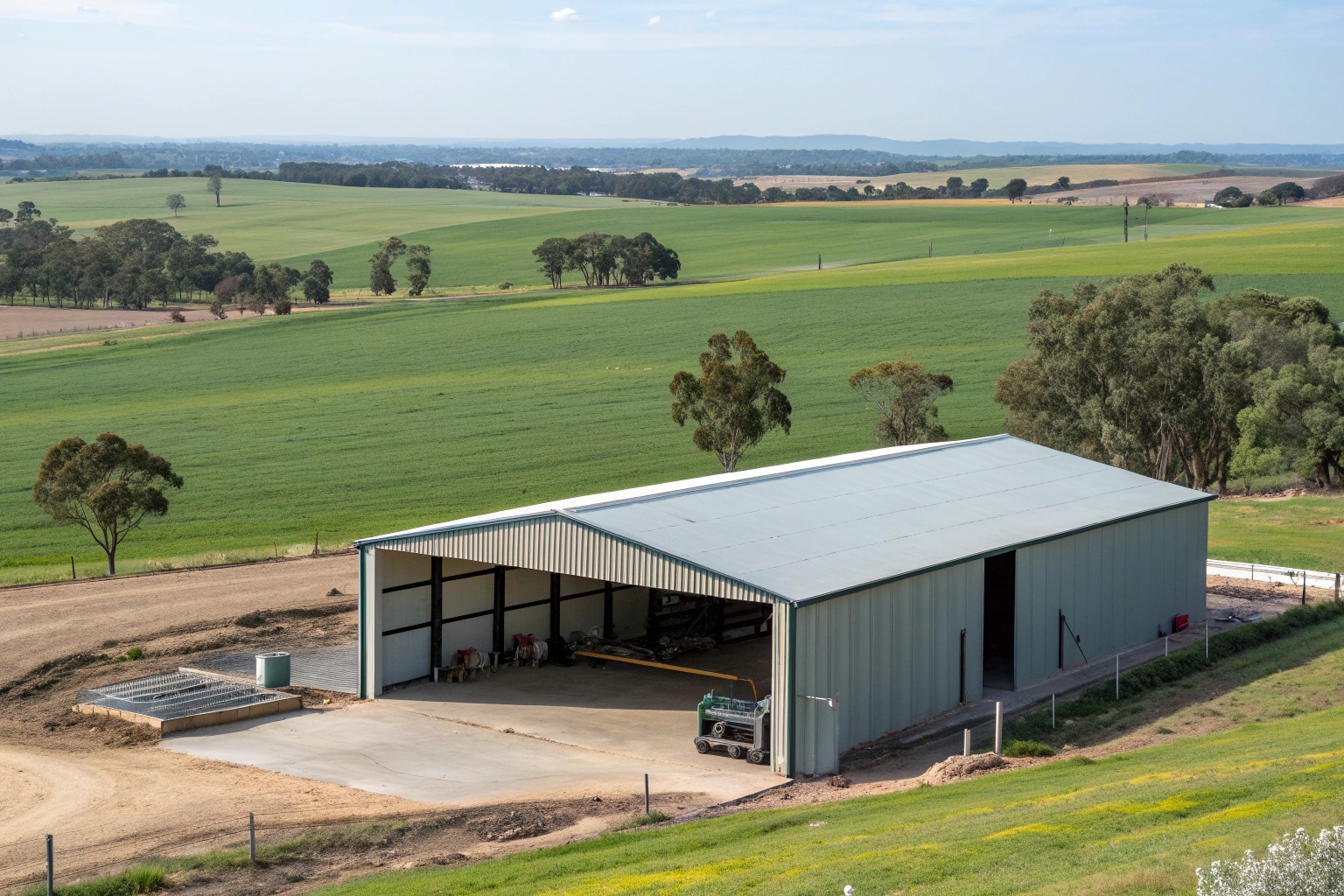 Farm machinery shed with concrete slab foundation in Dundathu rural property